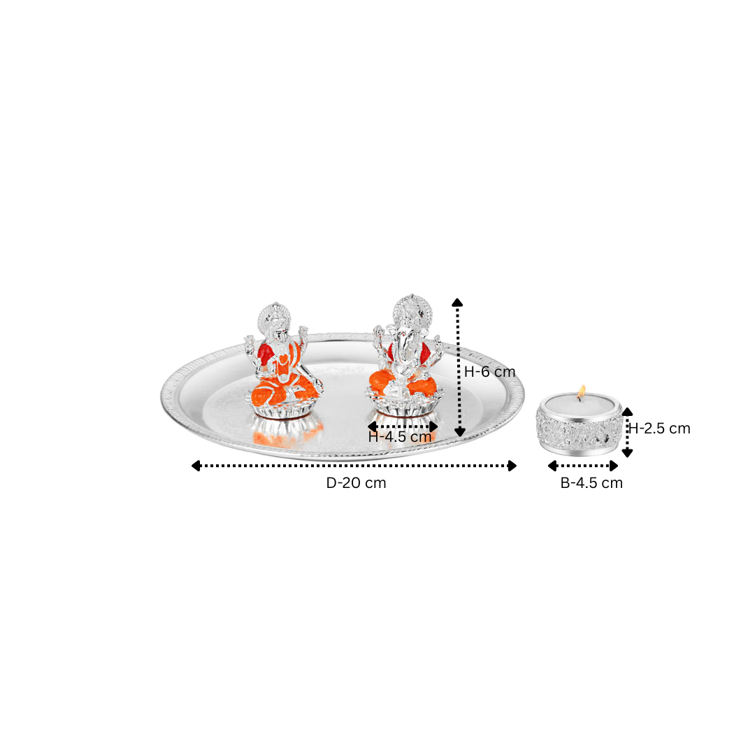 Puja thali with lakshmi ganesha on chowki & tea light.