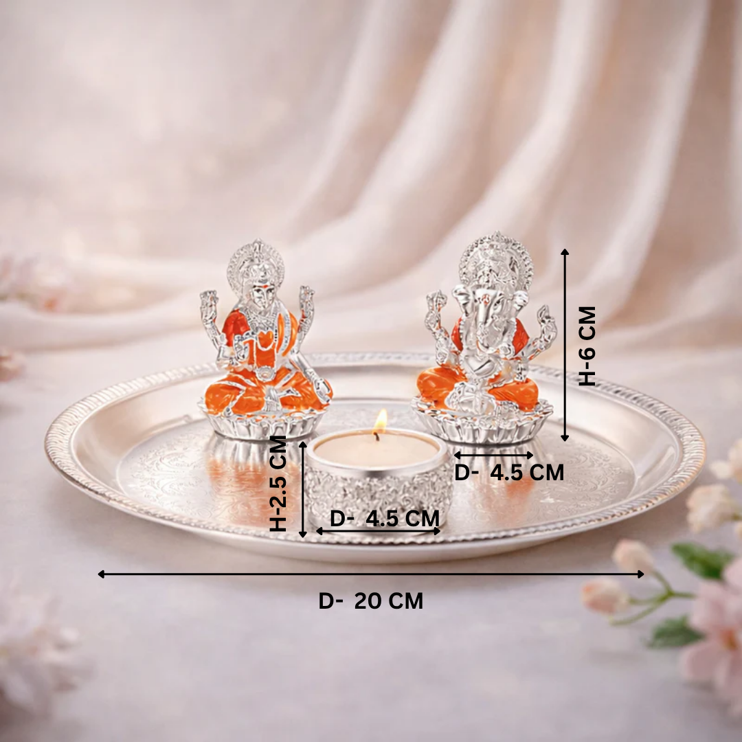 Puja thali with lakshmi ganesha on chowki & tea light.